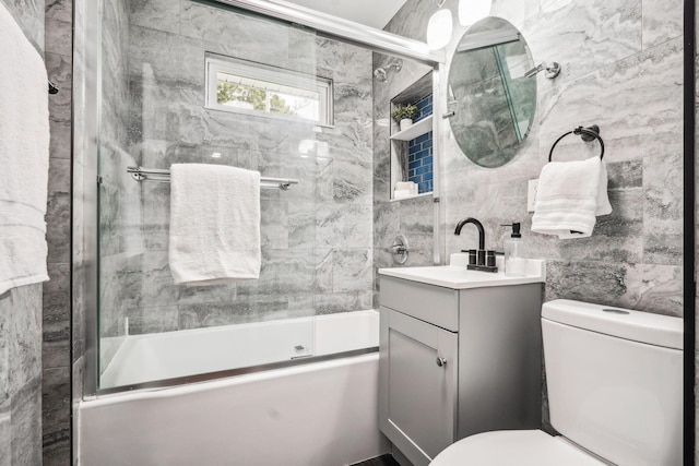 4425 Saint Ann Ln, Columbus, OH 43213 - bathroom with vanity, shower / bath combination with glass door, and tile walls