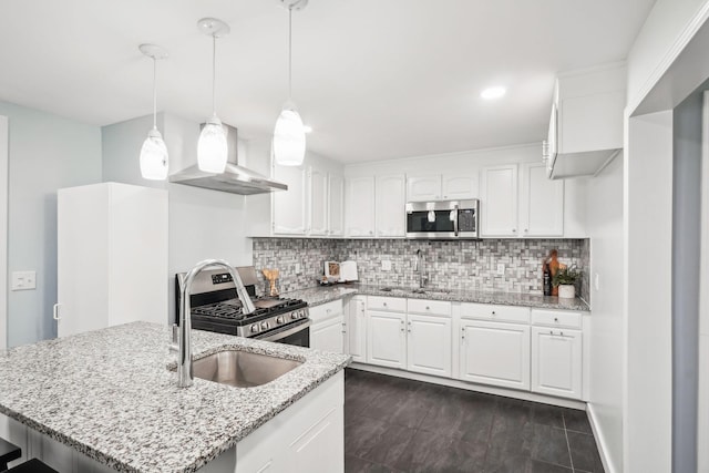 4425 Saint Ann Ln, Columbus, OH 43213 - kitchen featuring stainless steel appliances, wall chimney range hood, white cabinets, light stone countertops, and recessed lighting
