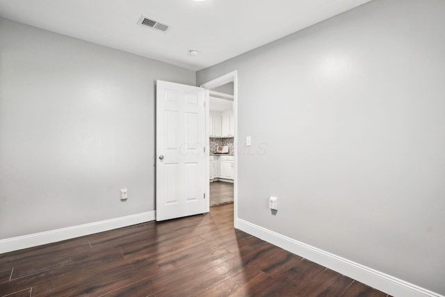 4425 Saint Ann Ln, Columbus, OH 43213 - unfurnished bedroom with baseboards and dark wood finished floors