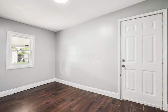 4425 Saint Ann Ln, Columbus, OH 43213 - unfurnished room with baseboards and dark wood finished floors