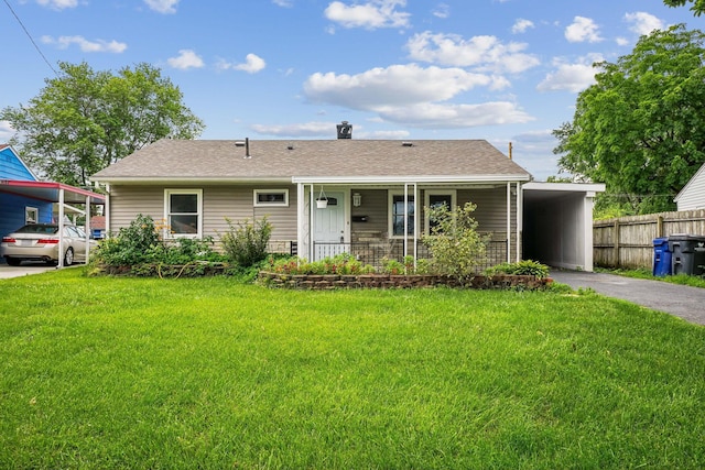 4425 Saint Ann Ln, Columbus, OH 43213 - view of front of house featuring a carport, asphalt driveway, a shingled roof, and a porch