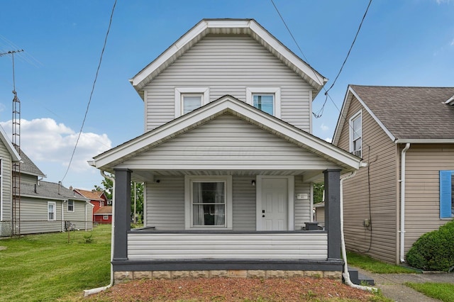 67 W Columbus St, Mount Sterling, OH 43143 - view of front of home with a porch and a front lawn