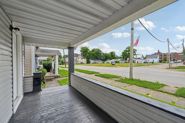 67 W Columbus St, Mount Sterling, OH 43143 - wooden porch featuring a residential view