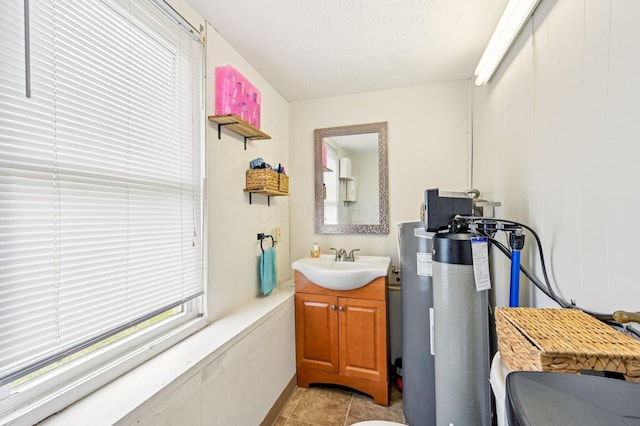 67 W Columbus St, Mount Sterling, OH 43143 - bathroom with vanity, tile patterned flooring, and a textured ceiling