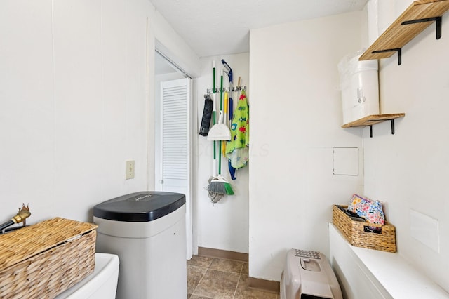 67 W Columbus St, Mount Sterling, OH 43143 - bathroom featuring toilet and stone finish floors