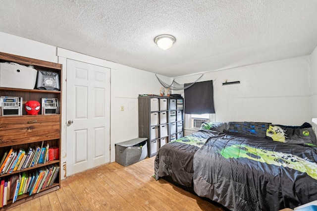 67 W Columbus St, Mount Sterling, OH 43143 - bedroom with hardwood / wood-style flooring and a textured ceiling
