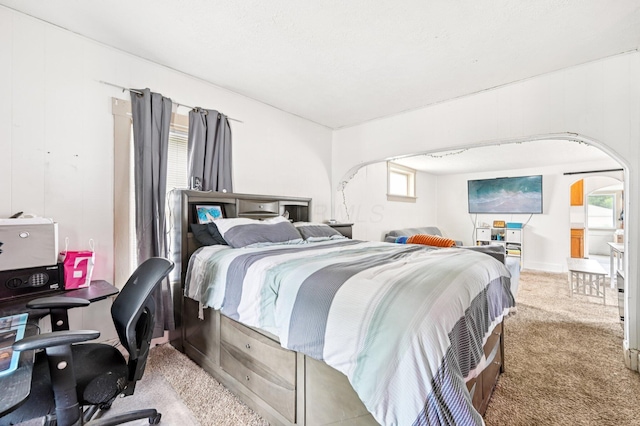67 W Columbus St, Mount Sterling, OH 43143 - bedroom with arched walkways, carpet, and a desk