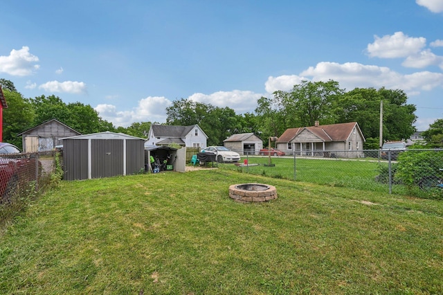 67 W Columbus St, Mount Sterling, OH 43143 - fenced backyard with a fire pit and a storage shed