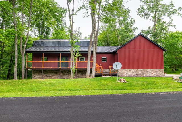 7326 State Route 19 Unit 8, Lots 255-257, Mount Gilead, OH 43338 - view of front of home with a front yard, a metal roof, and stone siding