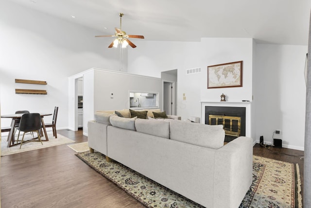3117 Rivermill Dr Unit 25, Columbus, OH 43220 - living area with ceiling fan, high vaulted ceiling, wood finished floors, and a glass covered fireplace