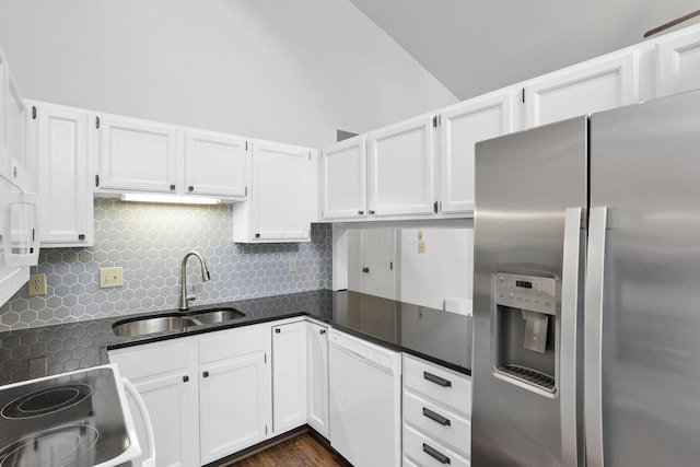 3117 Rivermill Dr Unit 25, Columbus, OH 43220 - kitchen featuring white appliances, backsplash, white cabinetry, vaulted ceiling, and dark wood-type flooring