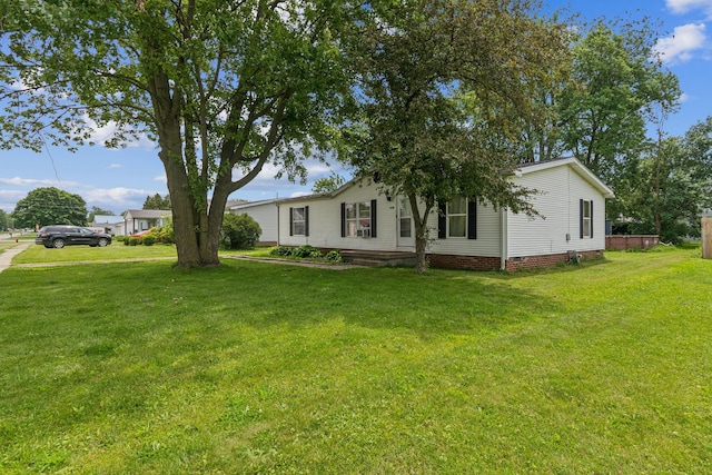 1609 Foraker Ave, Findlay, OH 45840 - view of home's exterior with a yard