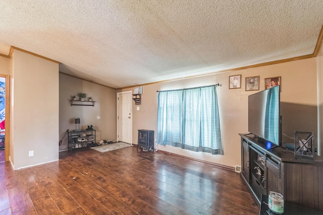 1609 Foraker Ave, Findlay, OH 45840 - living room with a wood stove, ornamental molding, dark wood-style flooring, and a textured ceiling