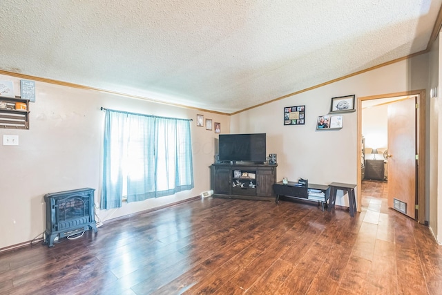1609 Foraker Ave, Findlay, OH 45840 - living room with a wood stove, a textured ceiling, ornamental molding, wood finished floors, and lofted ceiling