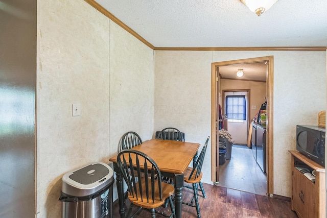 1609 Foraker Ave, Findlay, OH 45840 - dining space featuring crown molding, dark wood-style floors, and a textured ceiling