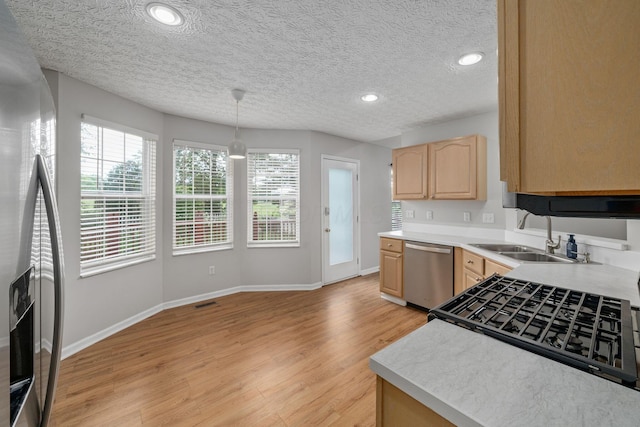 8135 Barlow Rd, Westerville, OH 43081 - kitchen featuring stainless steel appliances, light brown cabinetry, light wood-style floors, recessed lighting, and light countertops