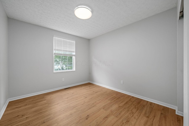 8135 Barlow Rd, Westerville, OH 43081 - unfurnished room featuring a textured ceiling and light wood-style floors