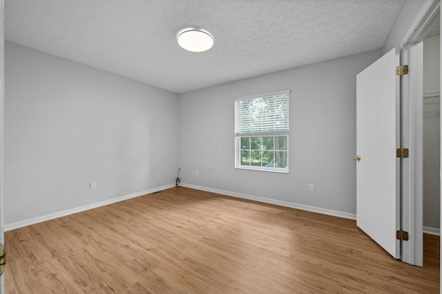 8135 Barlow Rd, Westerville, OH 43081 - unfurnished bedroom featuring light wood-style flooring and a textured ceiling
