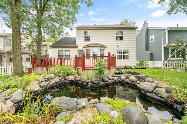 8135 Barlow Rd, Westerville, OH 43081 - rear view of property with a small pond and a wooden deck