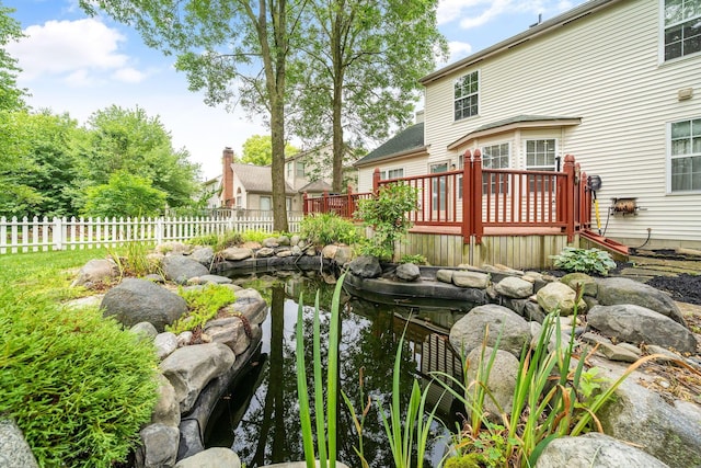8135 Barlow Rd, Westerville, OH 43081 - view of yard featuring a wooden deck and a small pond
