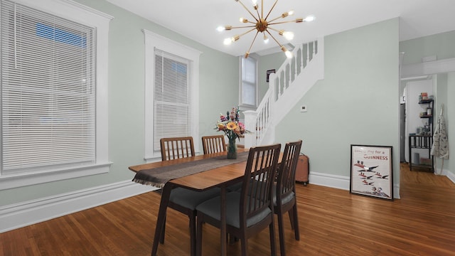 737 Wilson Ave, Columbus, OH 43205 - dining room with a chandelier, wood finished floors, and stairway