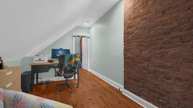737 Wilson Ave, Columbus, OH 43205 - office with lofted ceiling, wood finished floors, and brick wall