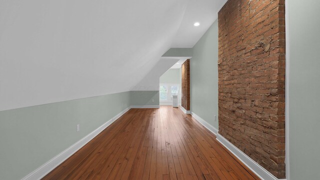 737 Wilson Ave, Columbus, OH 43205 - bonus room featuring vaulted ceiling, wood-type flooring, and brick wall