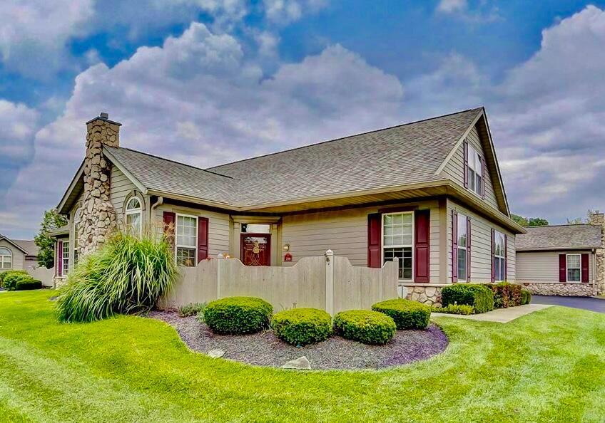715 Sherman Bluff Way, Lancaster, OH 43130 - view of home's exterior with a chimney, roof with shingles, and stone siding