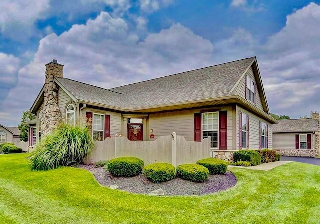 715 Sherman Bluff Way, Lancaster, OH 43130 - view of home's exterior with a chimney, roof with shingles, and stone siding