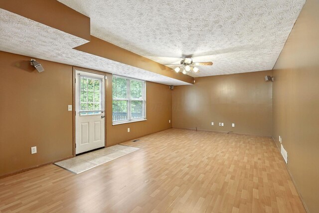 3576 Blendon Bend Way, Columbus, OH 43231 - unfurnished room with light wood-style floors, a textured ceiling, and a ceiling fan