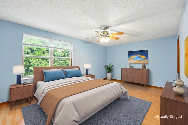 3576 Blendon Bend Way, Columbus, OH 43231 - bedroom featuring a textured ceiling, light wood-style floors, and ceiling fan