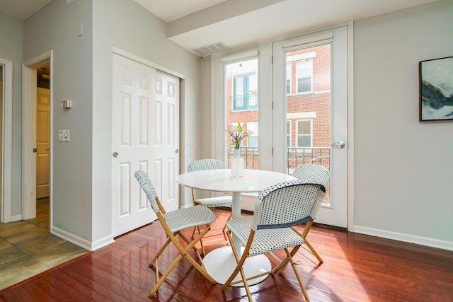 115 E Noble St Unit 2, Columbus, OH 43215 - dining room featuring wood finished floors and baseboards