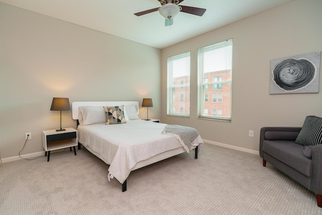 115 E Noble St Unit 2, Columbus, OH 43215 - bedroom with light carpet and ceiling fan