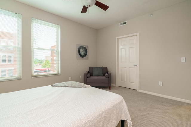115 E Noble St Unit 2, Columbus, OH 43215 - bedroom featuring light colored carpet and a ceiling fan