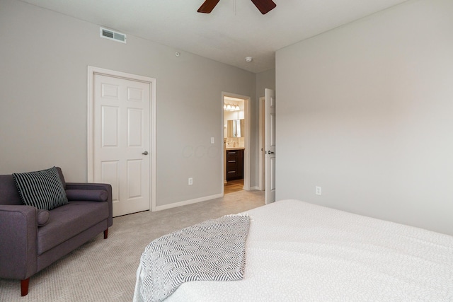 115 E Noble St Unit 2, Columbus, OH 43215 - bedroom with light colored carpet, connected bathroom, and a ceiling fan
