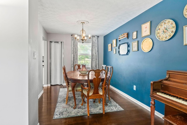 3221 E Hudson St, Columbus, OH 43219 - dining room featuring a chandelier, wood finished floors, and a textured ceiling