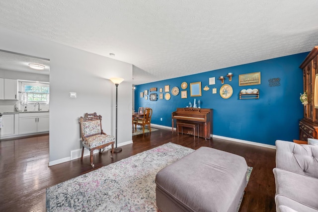 3221 E Hudson St, Columbus, OH 43219 - living room featuring a textured ceiling and wood finished floors
