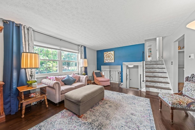 3221 E Hudson St, Columbus, OH 43219 - living area with a textured ceiling, wood finished floors, and stairs