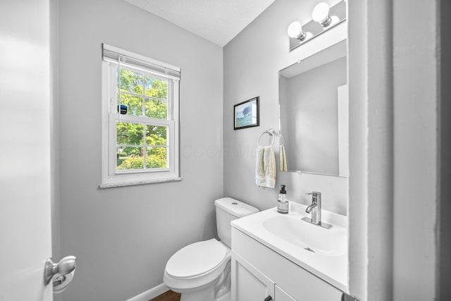 3221 E Hudson St, Columbus, OH 43219 - bathroom featuring vanity and a textured ceiling