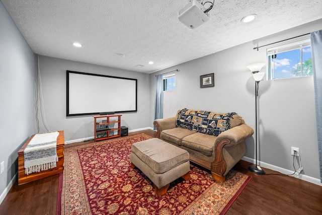 3221 E Hudson St, Columbus, OH 43219 - home theater room with a textured ceiling, wood finished floors, and recessed lighting