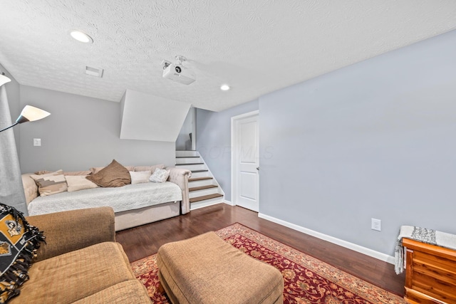 3221 E Hudson St, Columbus, OH 43219 - bedroom featuring wood finished floors, a textured ceiling, and recessed lighting