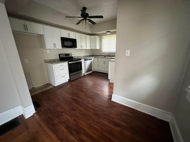 68 Moull St, Newark, OH 43055 - kitchen featuring appliances with stainless steel finishes, dark wood-style floors, white cabinets, and ceiling fan