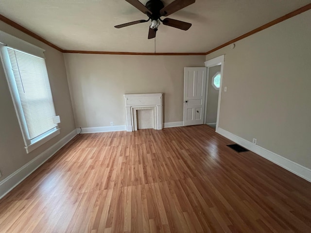 68 Moull St, Newark, OH 43055 - unfurnished living room featuring crown molding, wood finished floors, and ceiling fan