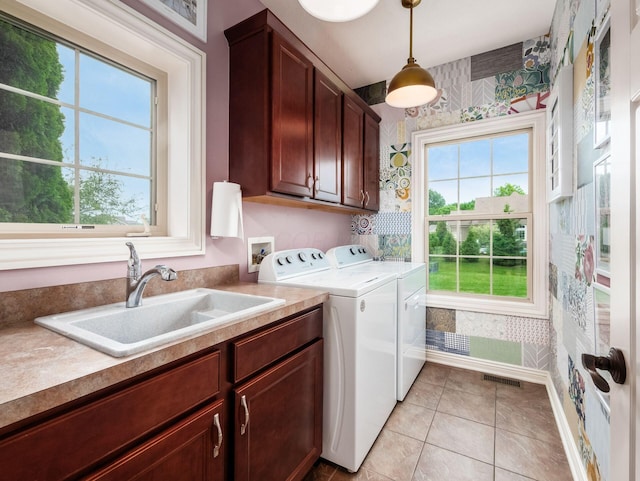 5808 Glendavon Loop, Dublin, OH 43016 - laundry area with cabinet space, wallpapered walls, separate washer and dryer, and light tile patterned floors