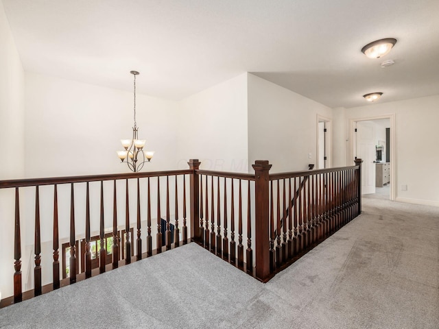 5808 Glendavon Loop, Dublin, OH 43016 - hall with a chandelier, carpet floors, and an upstairs landing