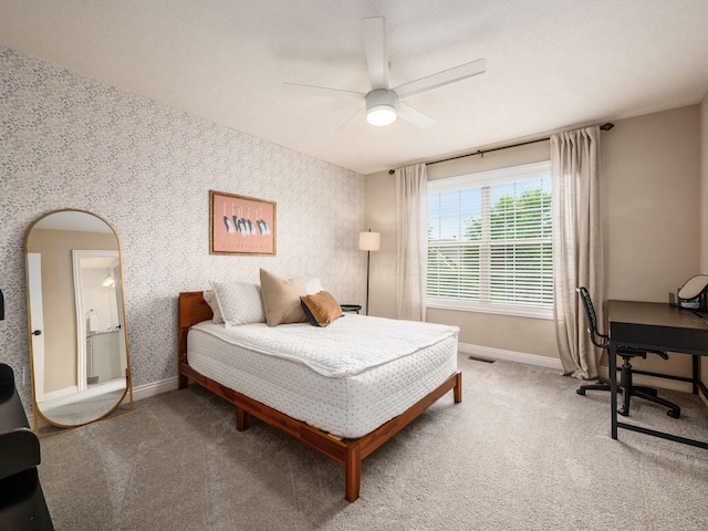 5808 Glendavon Loop, Dublin, OH 43016 - carpeted bedroom with wallpapered walls, a desk, a ceiling fan, and arched walkways