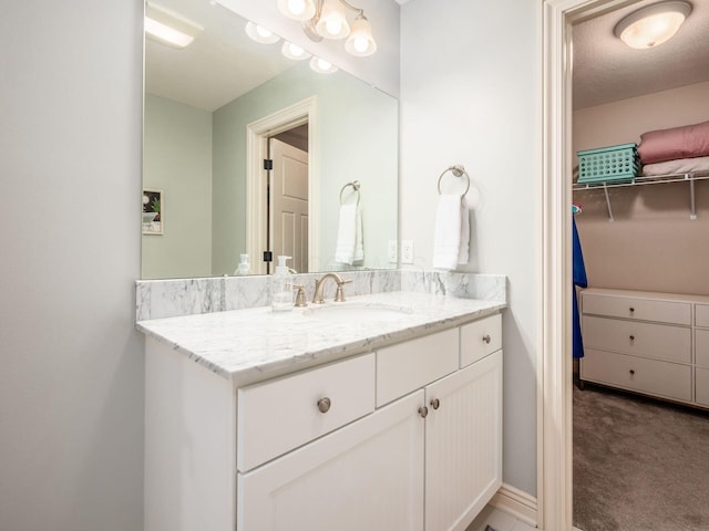 5808 Glendavon Loop, Dublin, OH 43016 - bathroom featuring vanity and a spacious closet