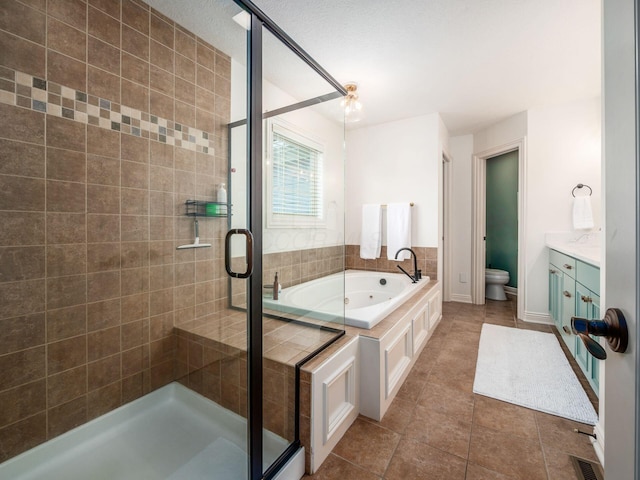 5808 Glendavon Loop, Dublin, OH 43016 - full bathroom with a tub with jets, a stall shower, vanity, and tile patterned flooring