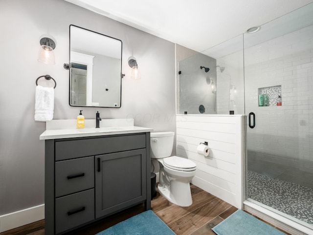 5808 Glendavon Loop, Dublin, OH 43016 - bathroom featuring wood finished floors, vanity, and a stall shower