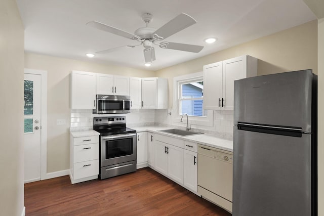 1614 Long St, Lancaster, OH 43130 - kitchen featuring appliances with stainless steel finishes, tasteful backsplash, white cabinetry, a ceiling fan, and recessed lighting